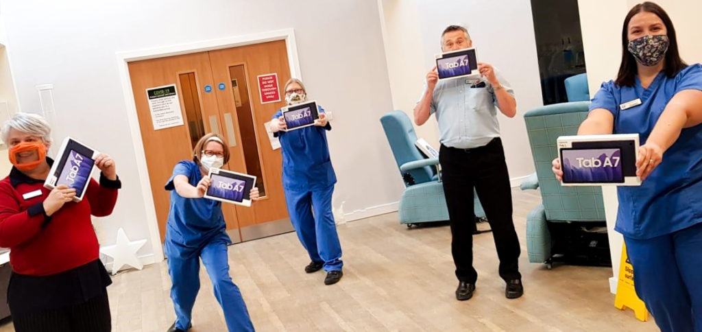 Mary Stevens Hospice Team Holding New Tablet Devices