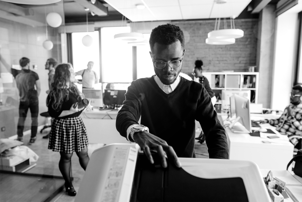 Man using printer in office